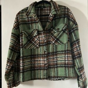 Lulu’s Sit Fireside green plaid jacket.